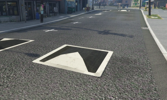 UK textured speed bump with white triangular road markings on a FiveM street