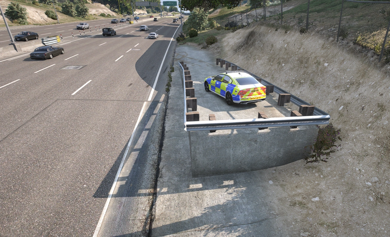 Police vehicle on an elevated motorway vantage point ramp beside the hard shoulder